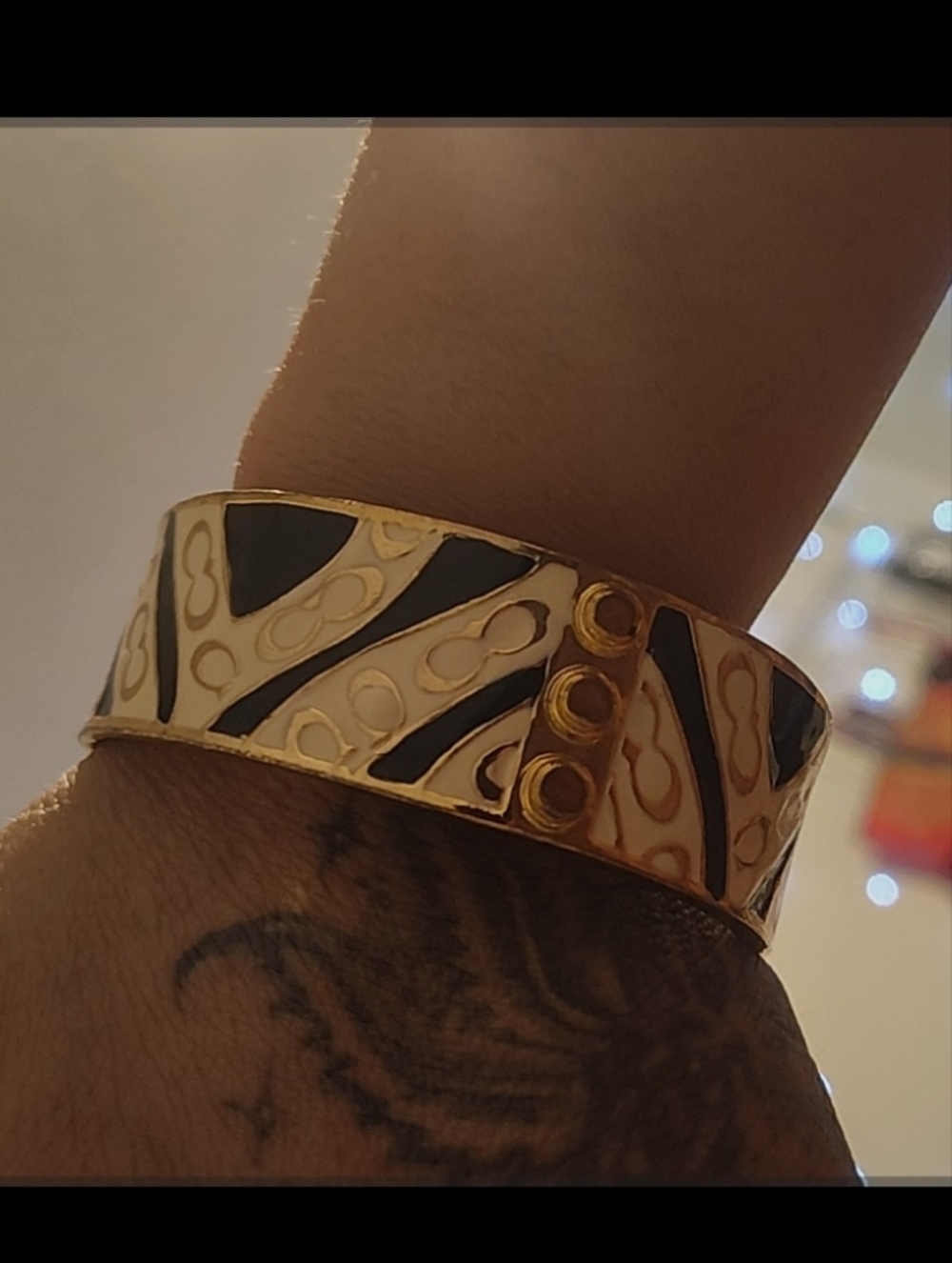 Coach Gold-Tone Embossed Logo Cuff Bracelet